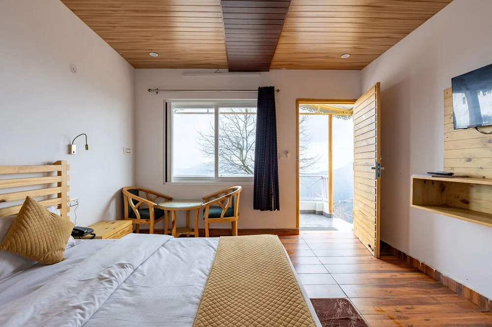Interior view of Double Room at Deodar Stays Kanatal
